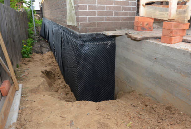 Happy homeowners after waterproofing job in Amboy